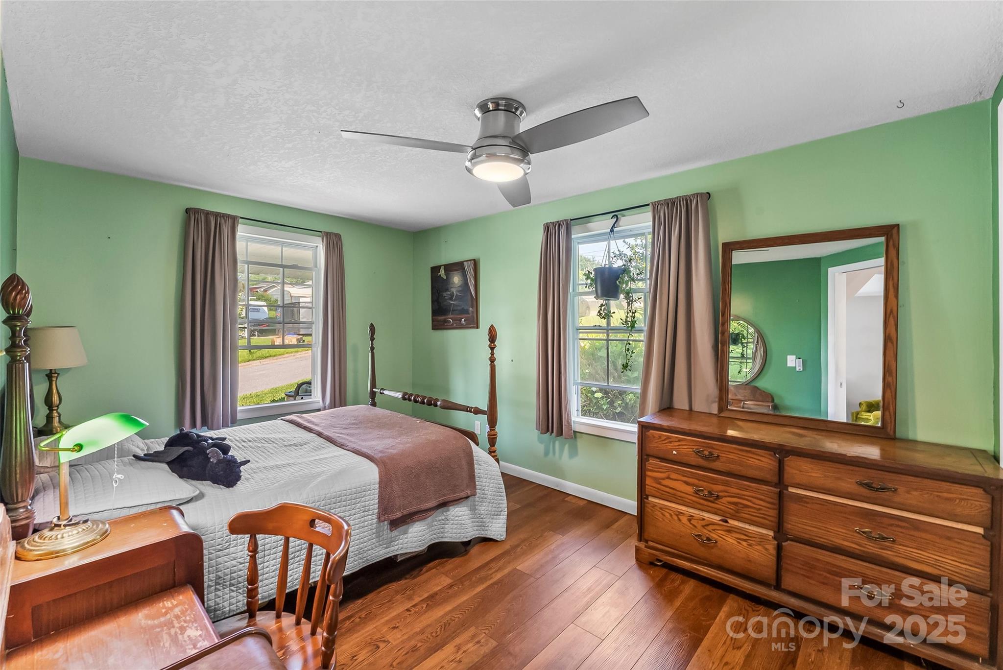 70 1st Street Canton, NC 28716 - Photo 9 of 34 a bedroom with a bed and large windows