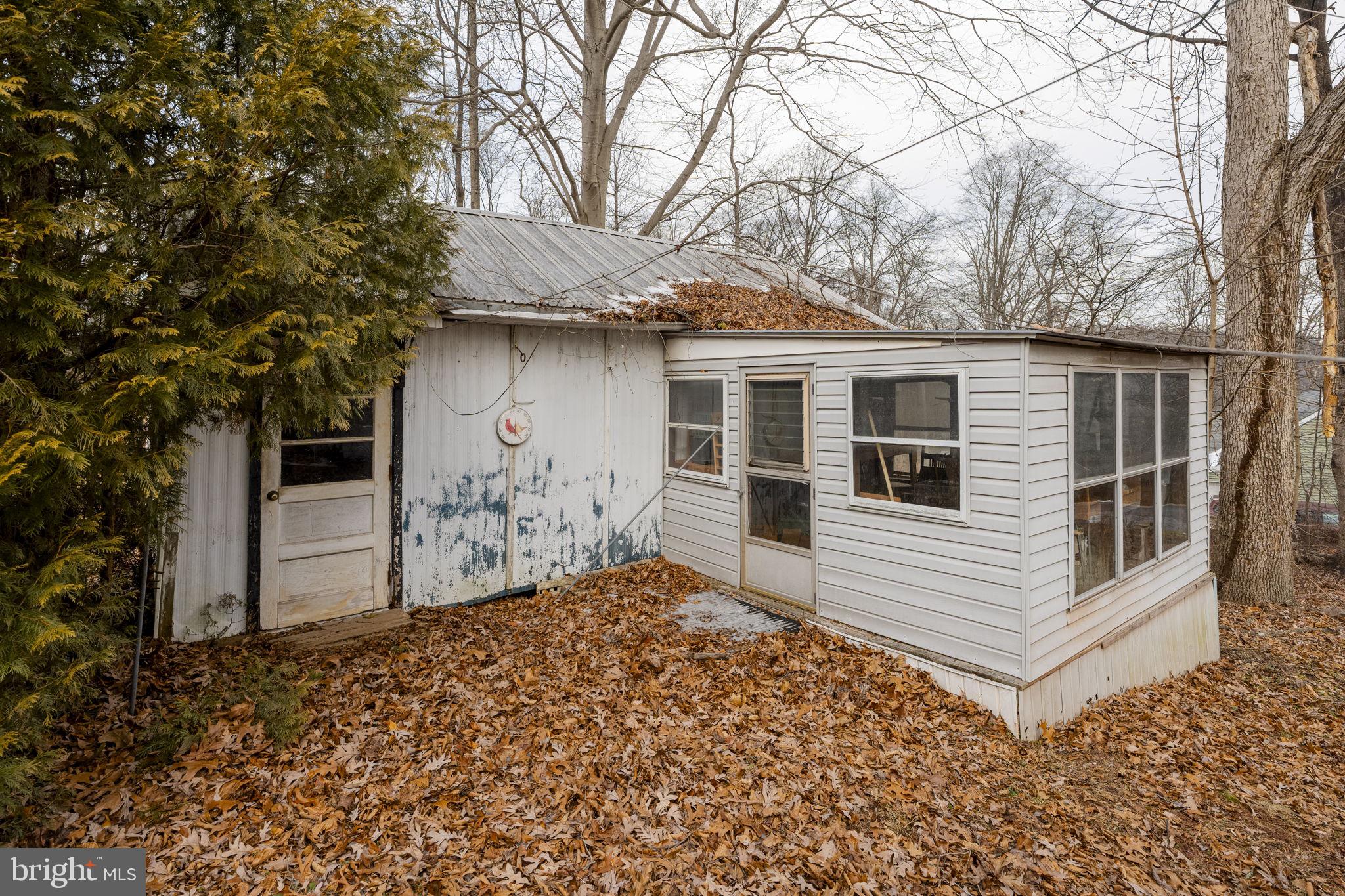 105 Wollups Hill Road Denver, PA 17517 - Photo 12 of 14 a front view of a house with a yard