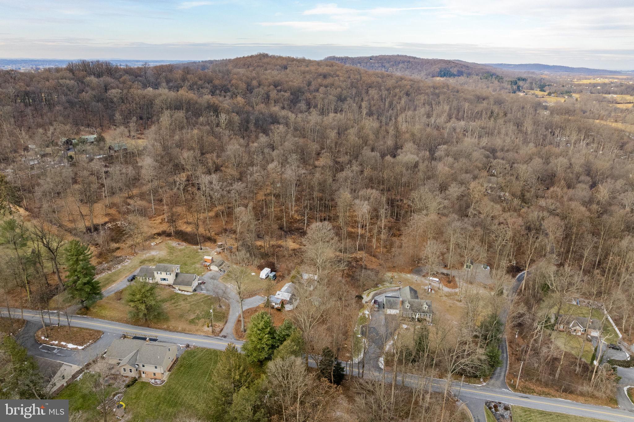 105 Wollups Hill Road Denver, PA 17517 - Photo 3 of 14 an aerial view of house with yard and mountain view in back