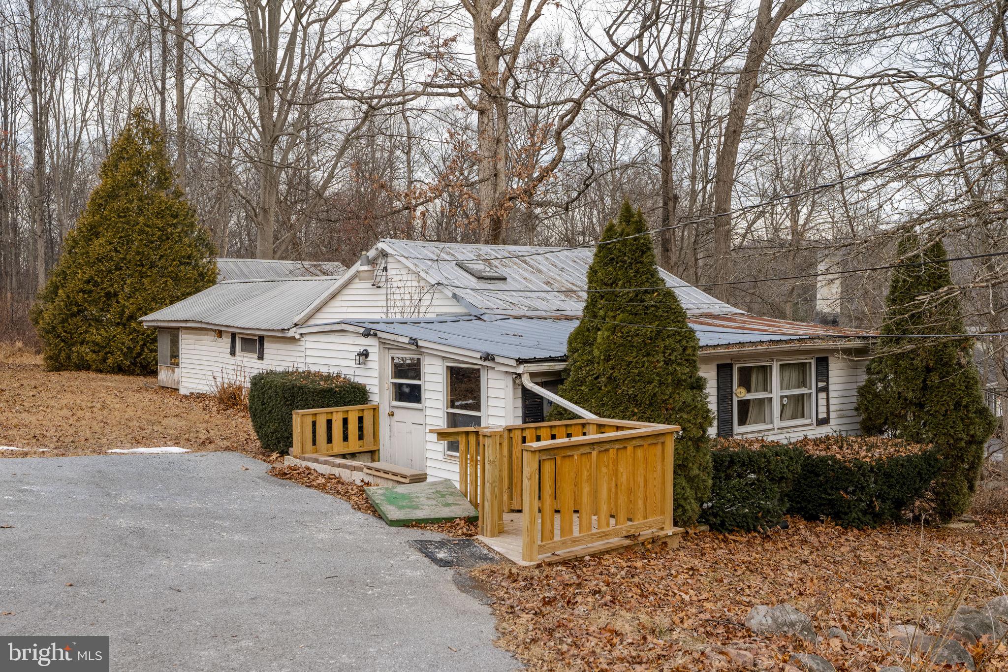 105 Wollups Hill Road Denver, PA 17517 - Photo 8 of 14 front view of a house with a yard