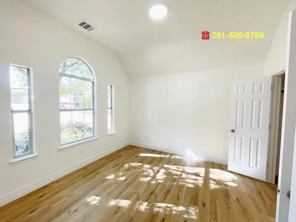 a large kitchen with stainless steel appliances kitchen island granite countertop a sink and cabinets