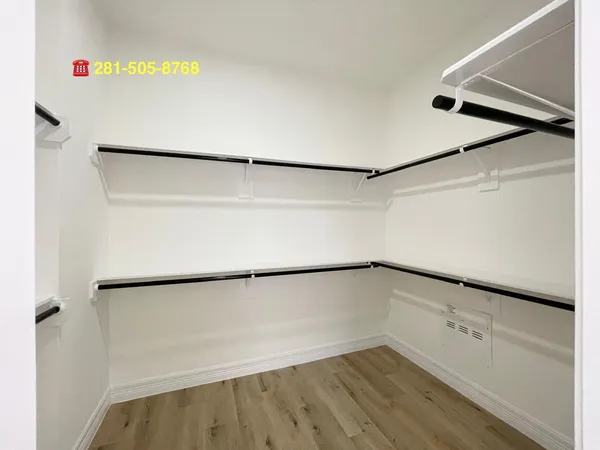 a view of an empty walk in closet