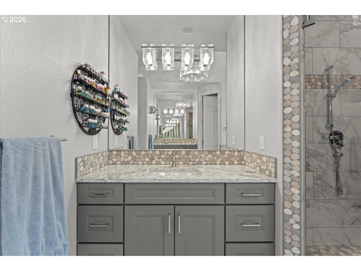 37123 Northeast Reed Road Corbett, OR 97019 - Photo 26 of 48 a bathroom with a sink vanity and a mirror