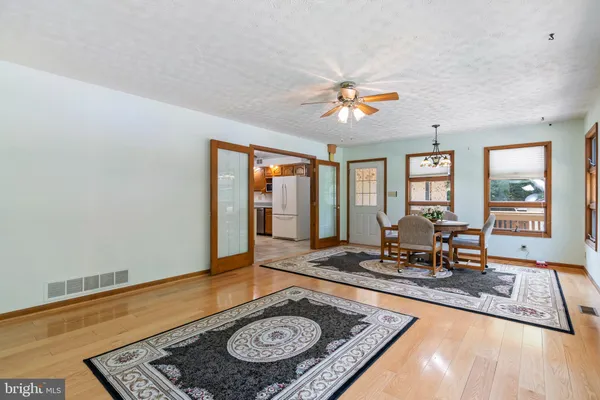 a spacious bedroom with a bed and a couch