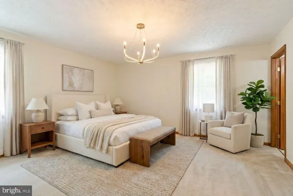 an empty room with fan and windows