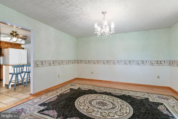 a very nice looking dining room with a rug