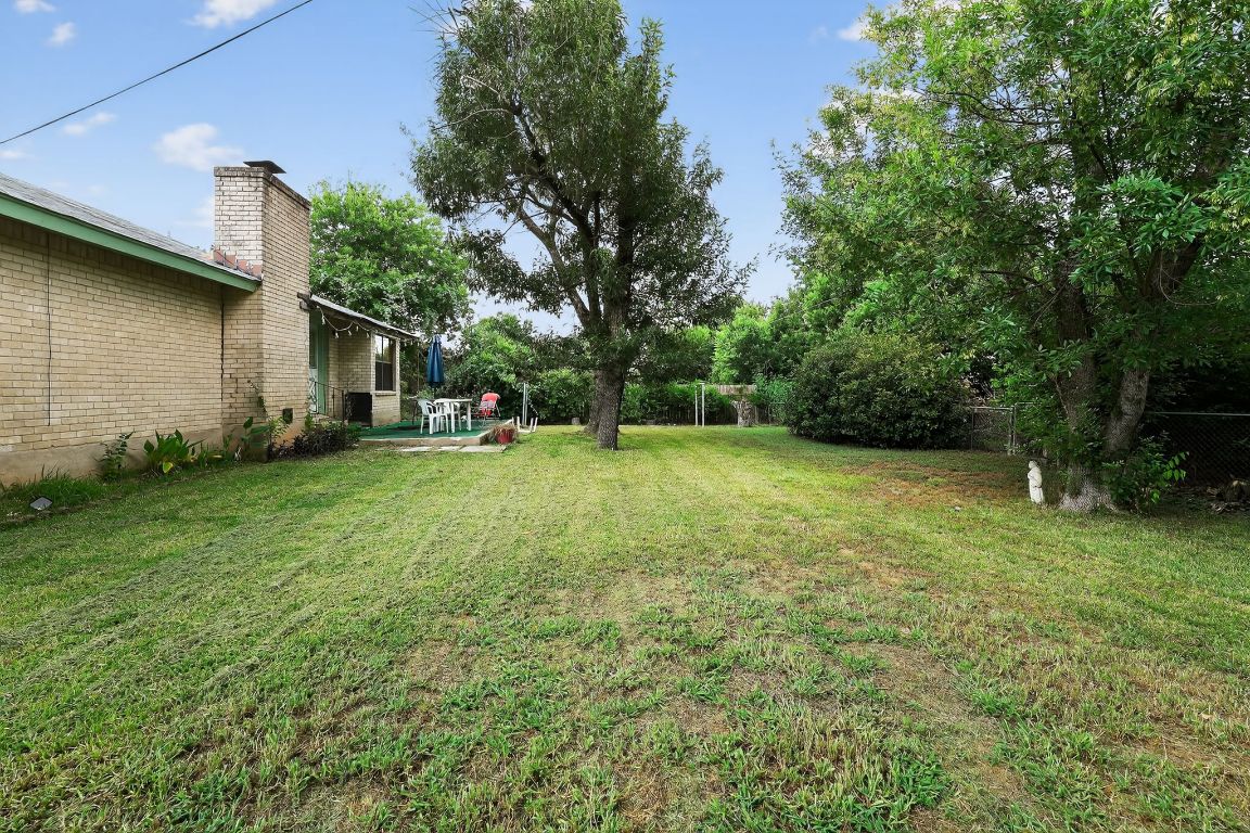 324 McClendon Drive Elgin, TX 78621 - Photo 13 of 16 a view of a backyard with a garden