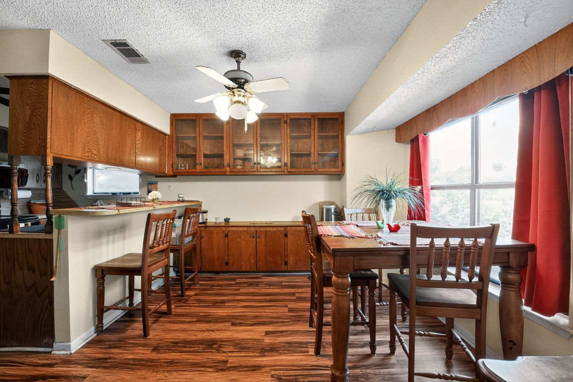 324 McClendon Drive Elgin, TX 78621 - Photo 7 of 16 a view of a dining room with furniture window and wooden floor