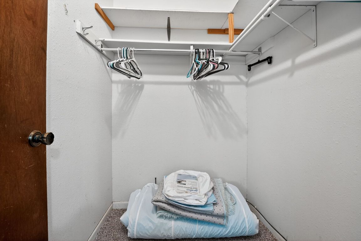 324 McClendon Drive Elgin, TX 78621 - Photo 9 of 16 a view of walk in closet with clothes and shoes