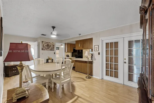 a dining room with furniture and window