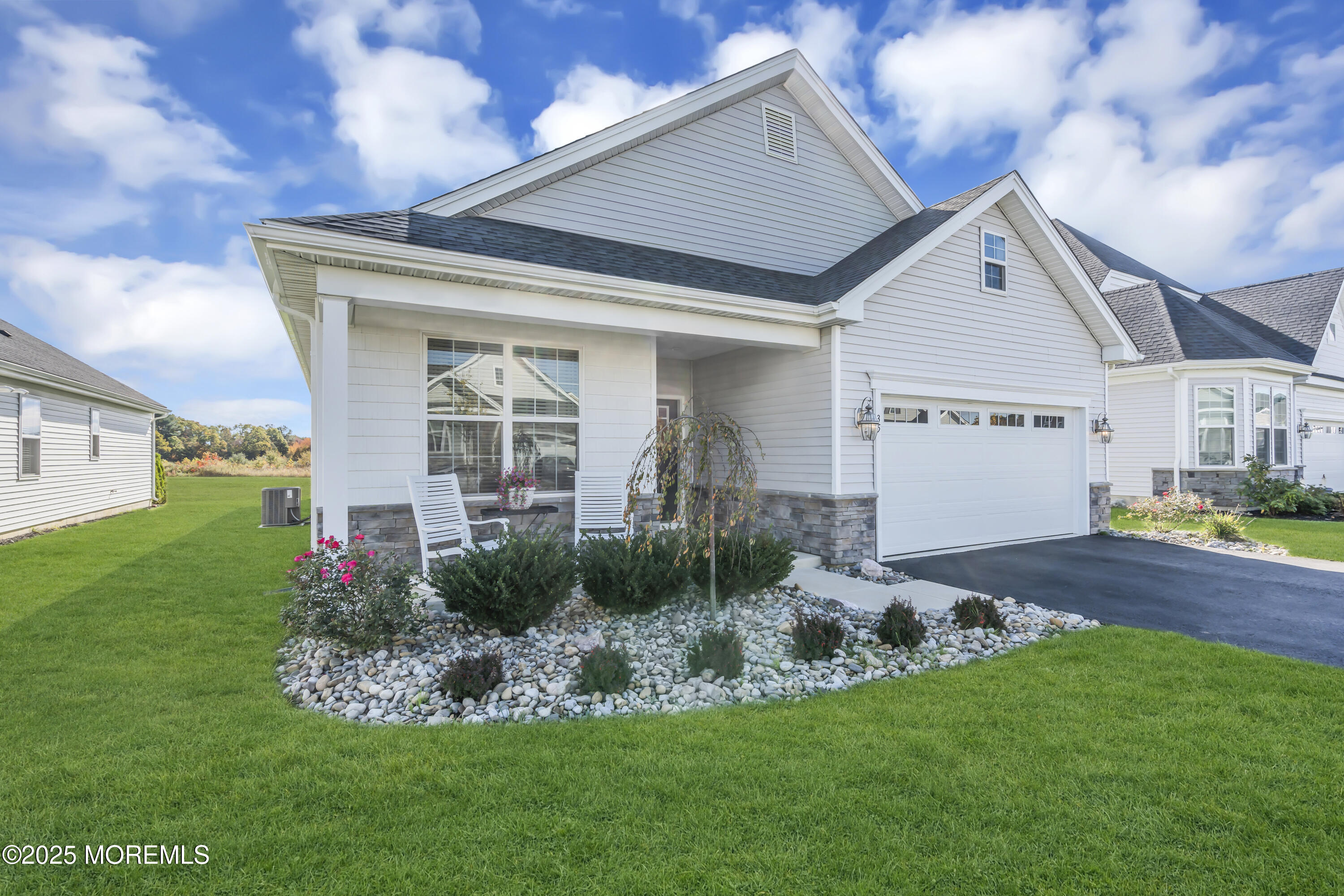 a front view of a house with garden