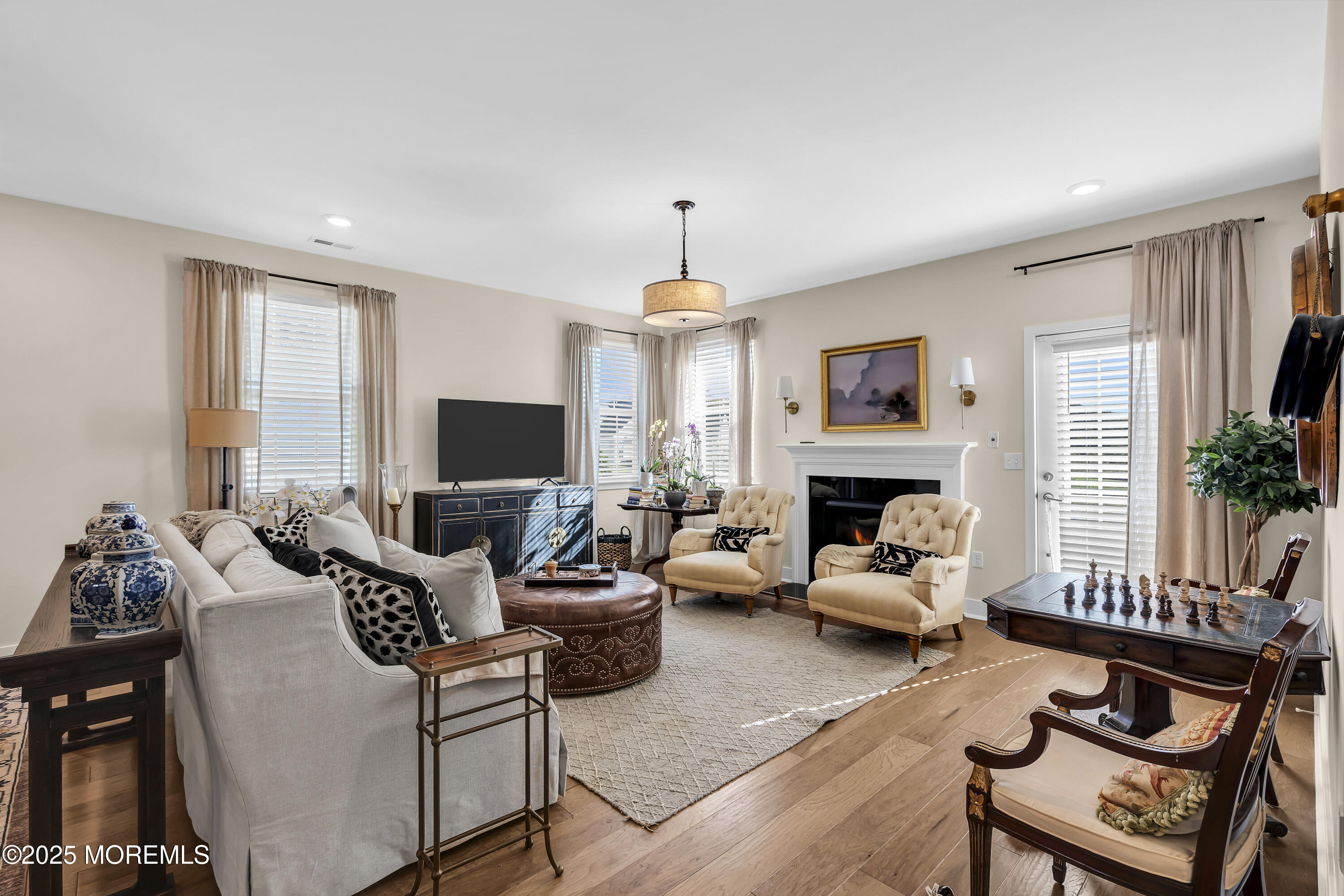 35 Saratoga Road New Egypt, NJ 08533 - Photo 15 of 41 a living room with furniture a fireplace and a flat screen tv