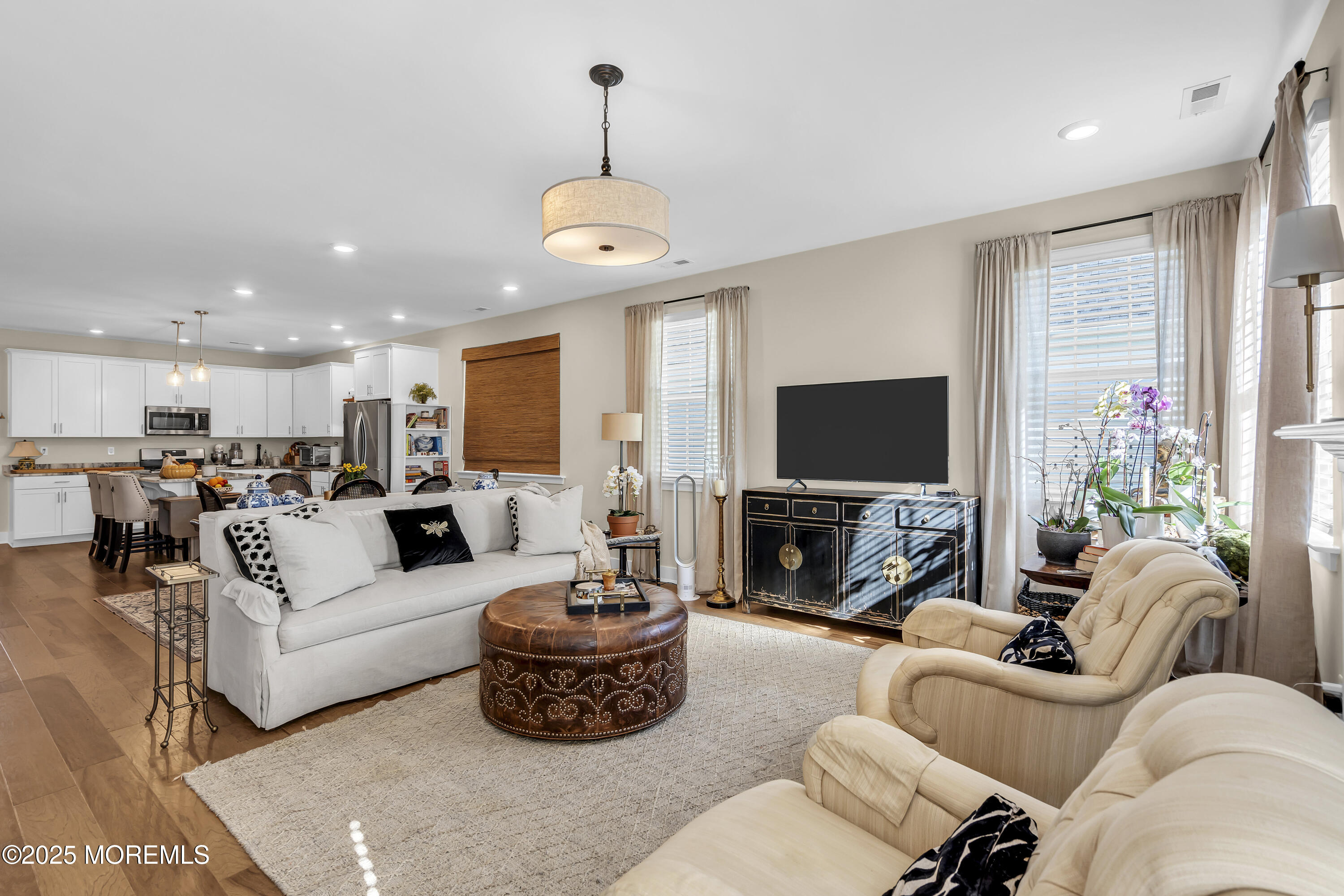 35 Saratoga Road New Egypt, NJ 08533 - Photo 16 of 41 a living room with furniture a flat screen tv and a fireplace