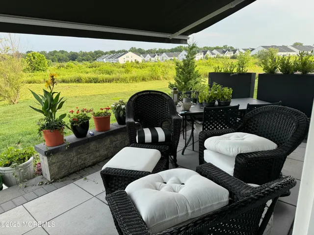 a couple of chairs sitting in front of a window