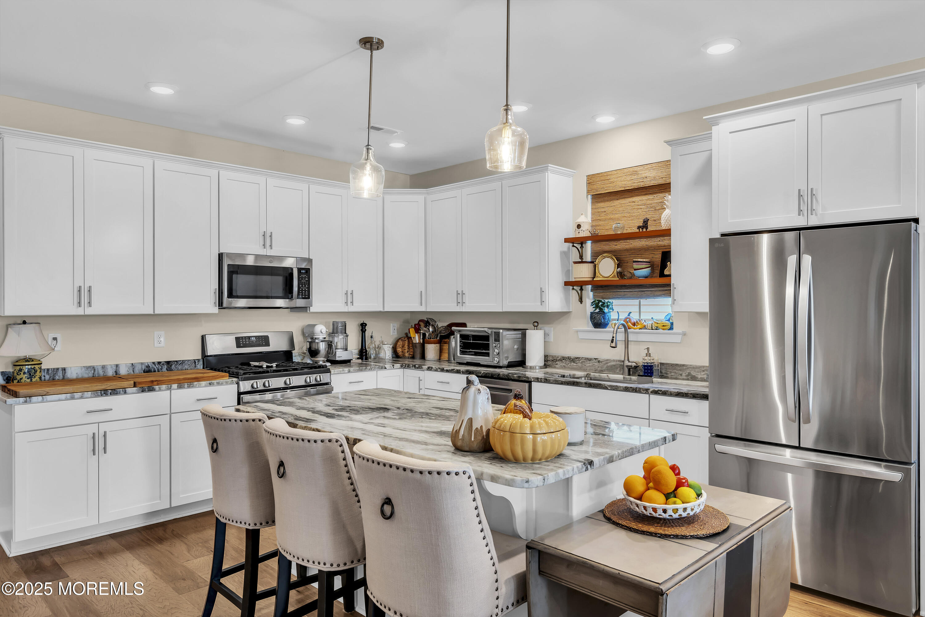 35 Saratoga Road New Egypt, NJ 08533 - Photo 6 of 41 a kitchen with a refrigerator a stove a sink and chairs