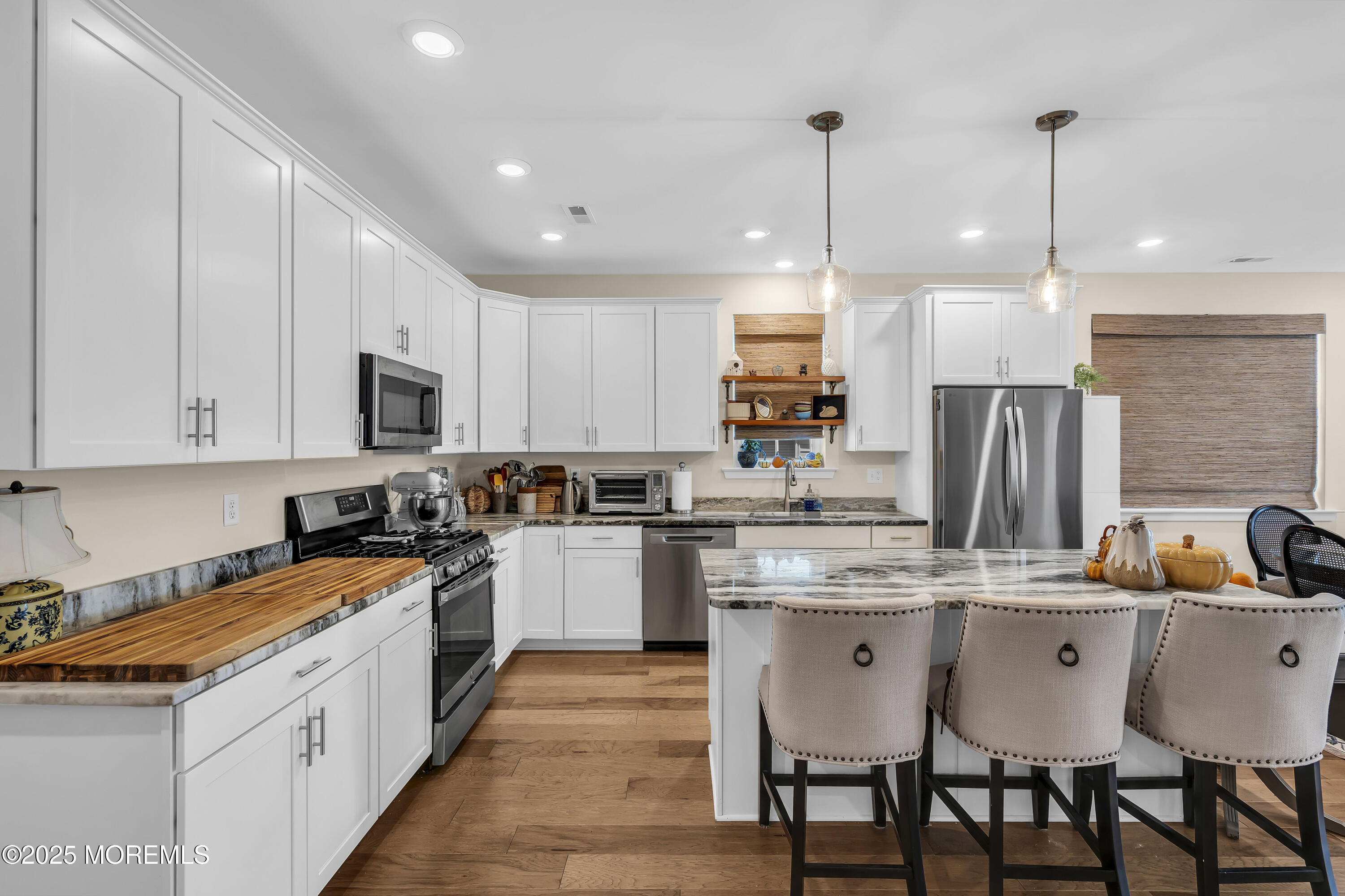 35 Saratoga Road New Egypt, NJ 08533 - Photo 8 of 41 a kitchen with stainless steel appliances granite countertop a sink a stove a refrigerator and chairs