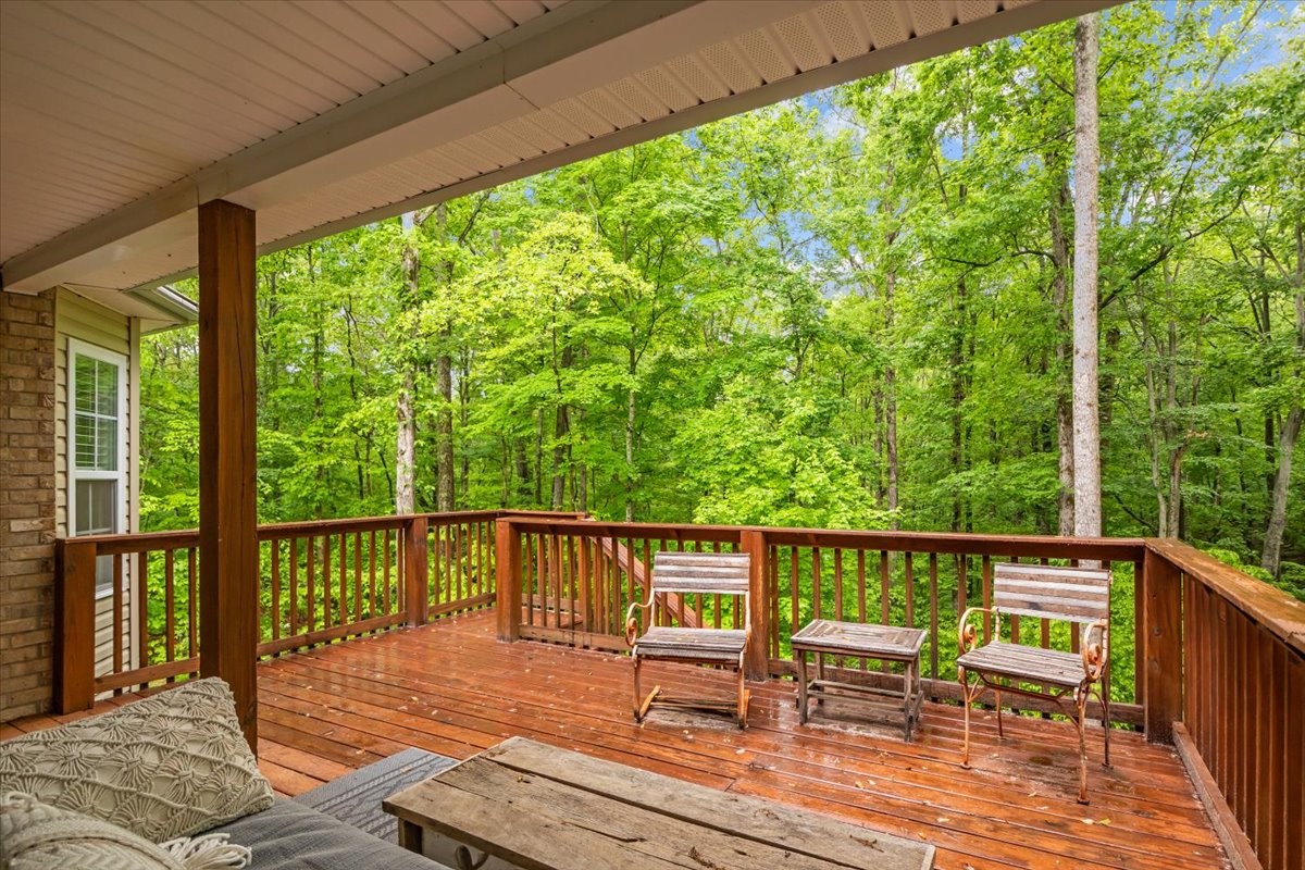 7327 Hunting Camp Road Fairview, TN 37062 - Photo 20 of 83 a view of a chair and table on the deck