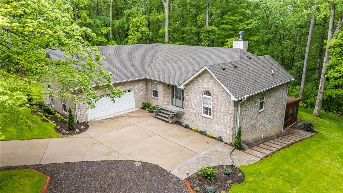 7327 Hunting Camp Road Fairview, TN 37062 - Photo 2 of 83 an aerial view of a house with a yard and large tree