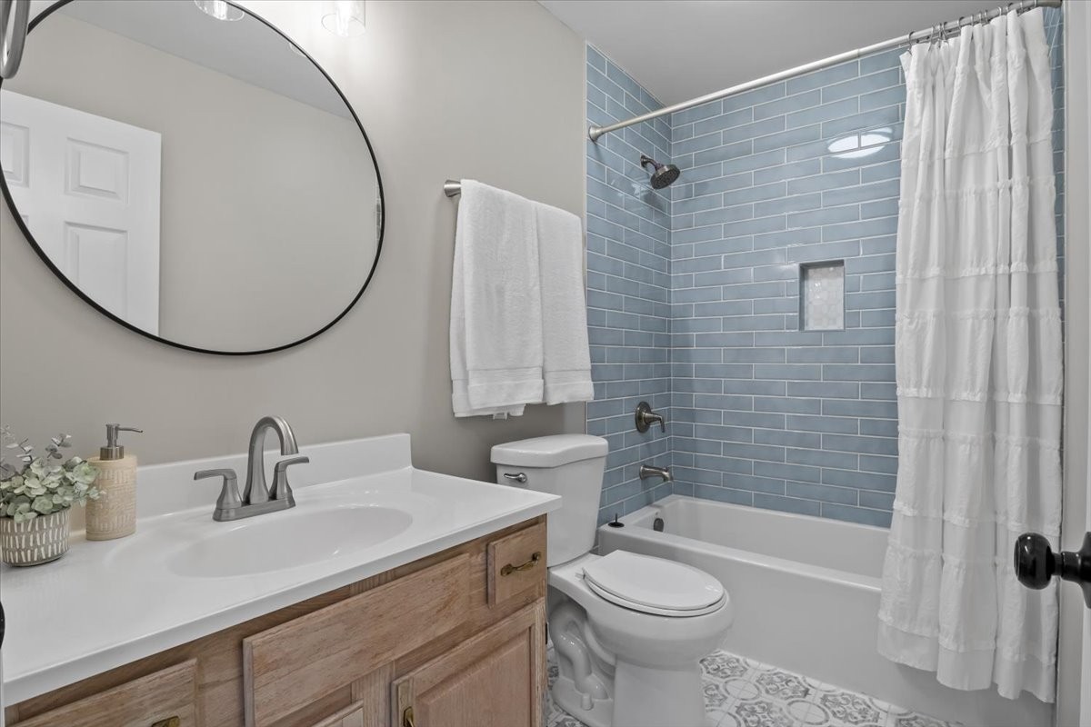 7327 Hunting Camp Road Fairview, TN 37062 - Photo 31 of 83 a bathroom with a sink a toilet and shower