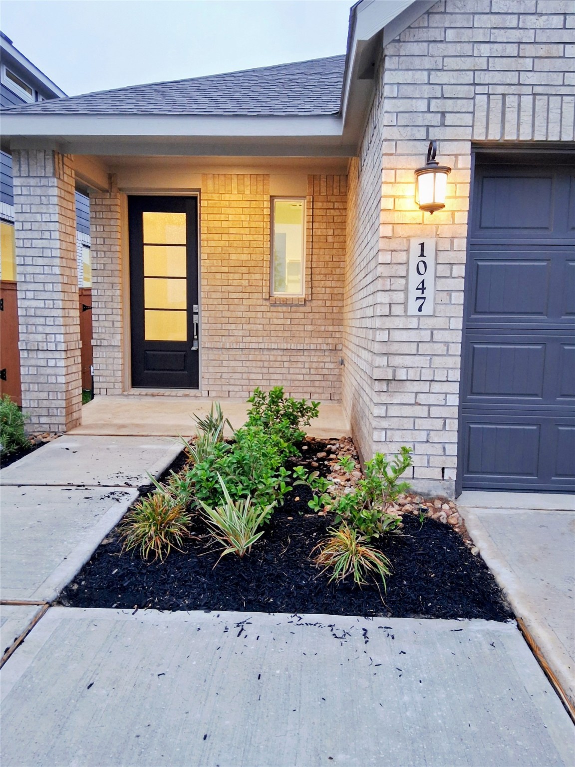 1047 Blue Stone Drive Beasley, TX 77417 - Photo 2 of 11 a view of a brick house with potted plants