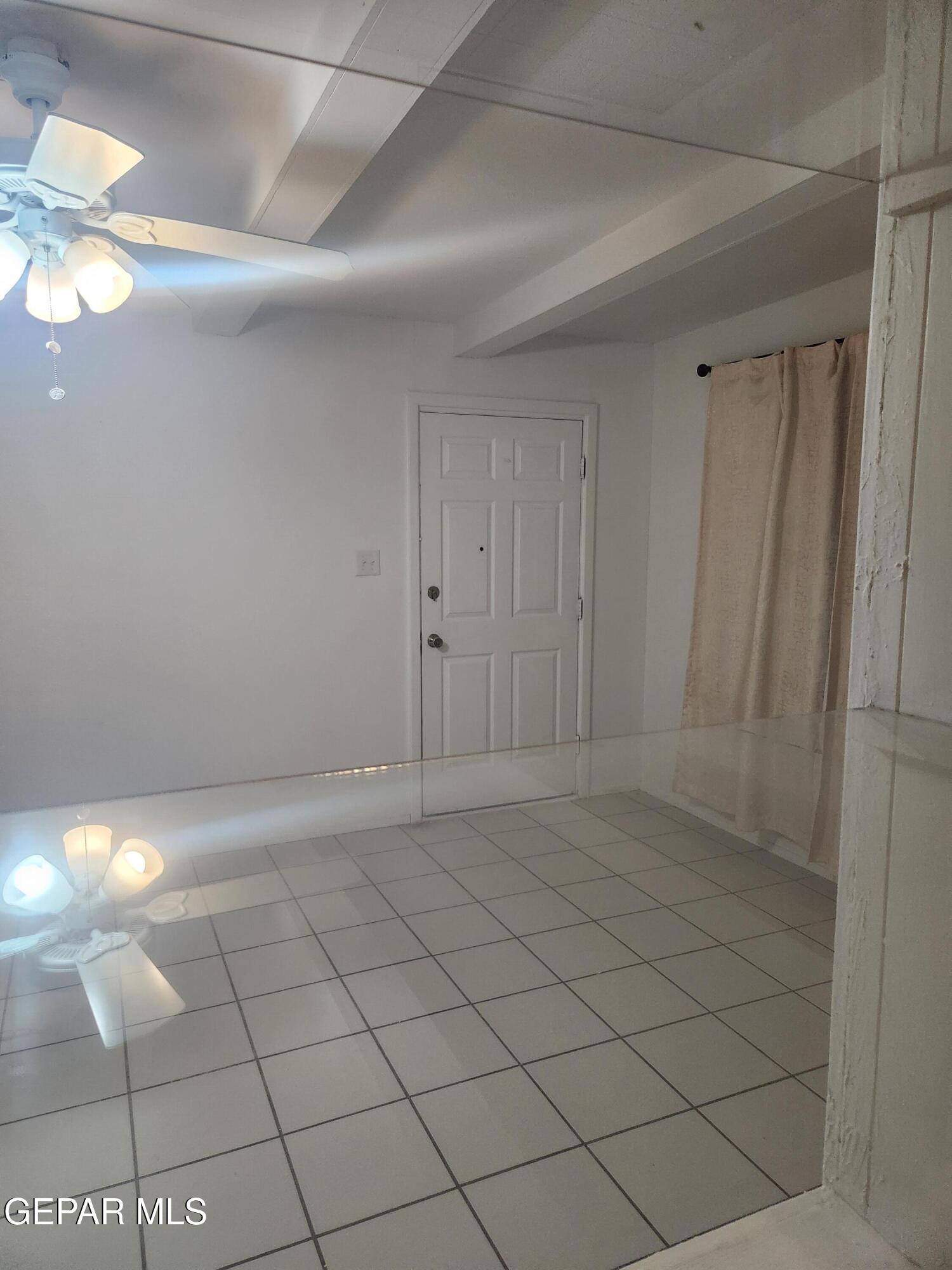 226 Coronado Road El Paso, TX 79915 - Photo 13 of 22 a view of an empty room and chandelier fan