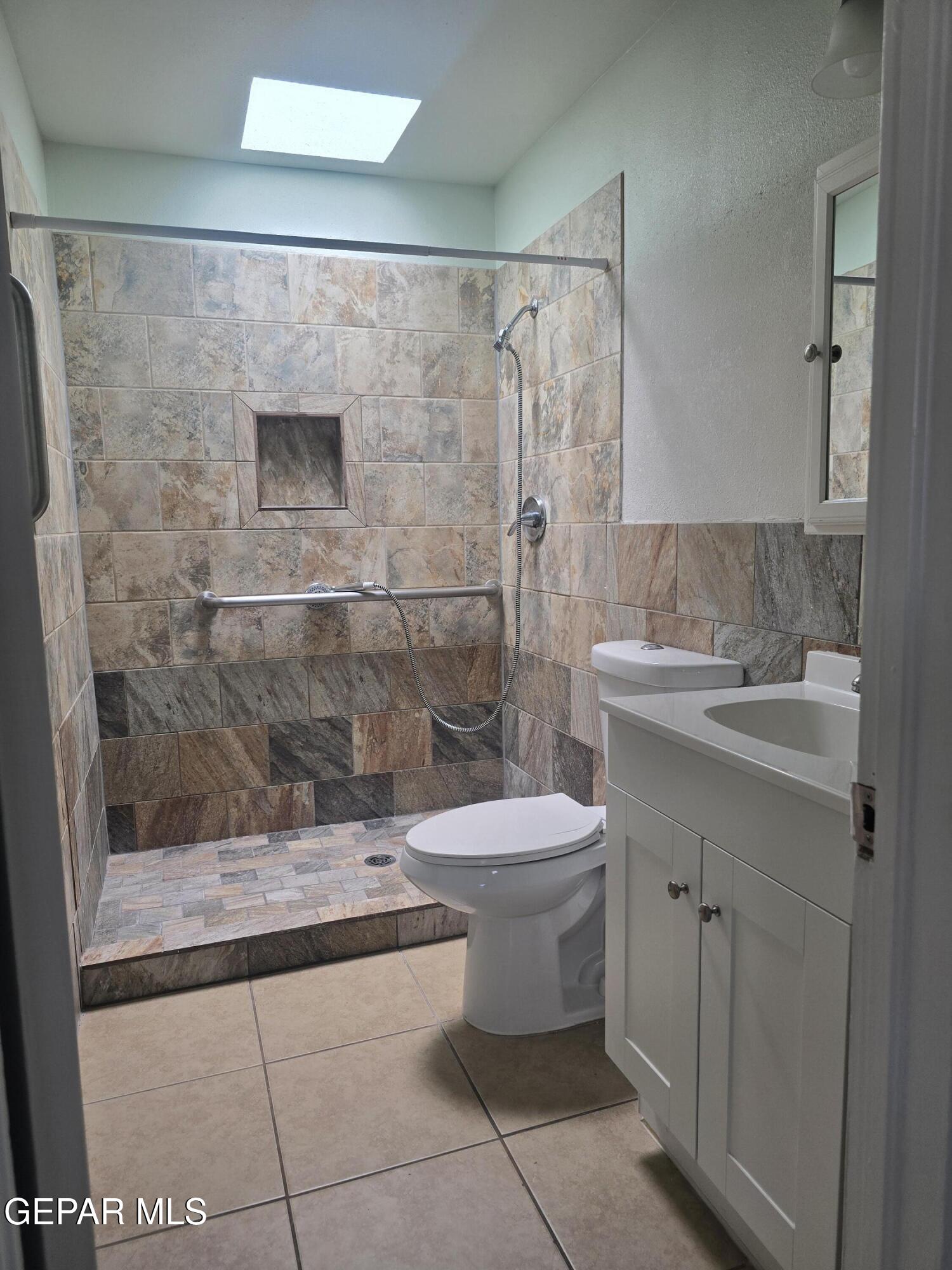 226 Coronado Road El Paso, TX 79915 - Photo 14 of 22 a bathroom with a toilet sink and shower
