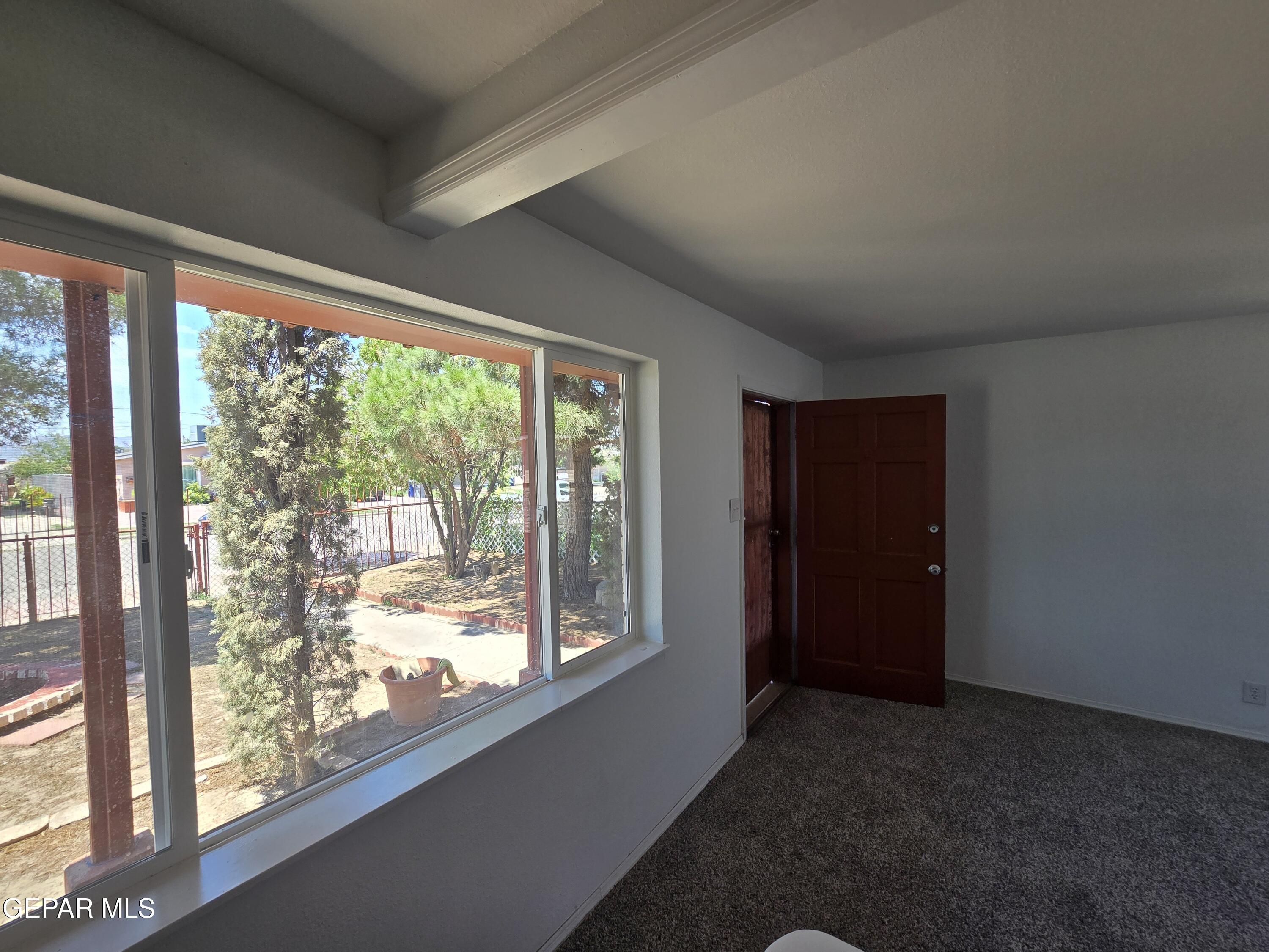 226 Coronado Road El Paso, TX 79915 - Photo 4 of 22 a view of empty room with large windows