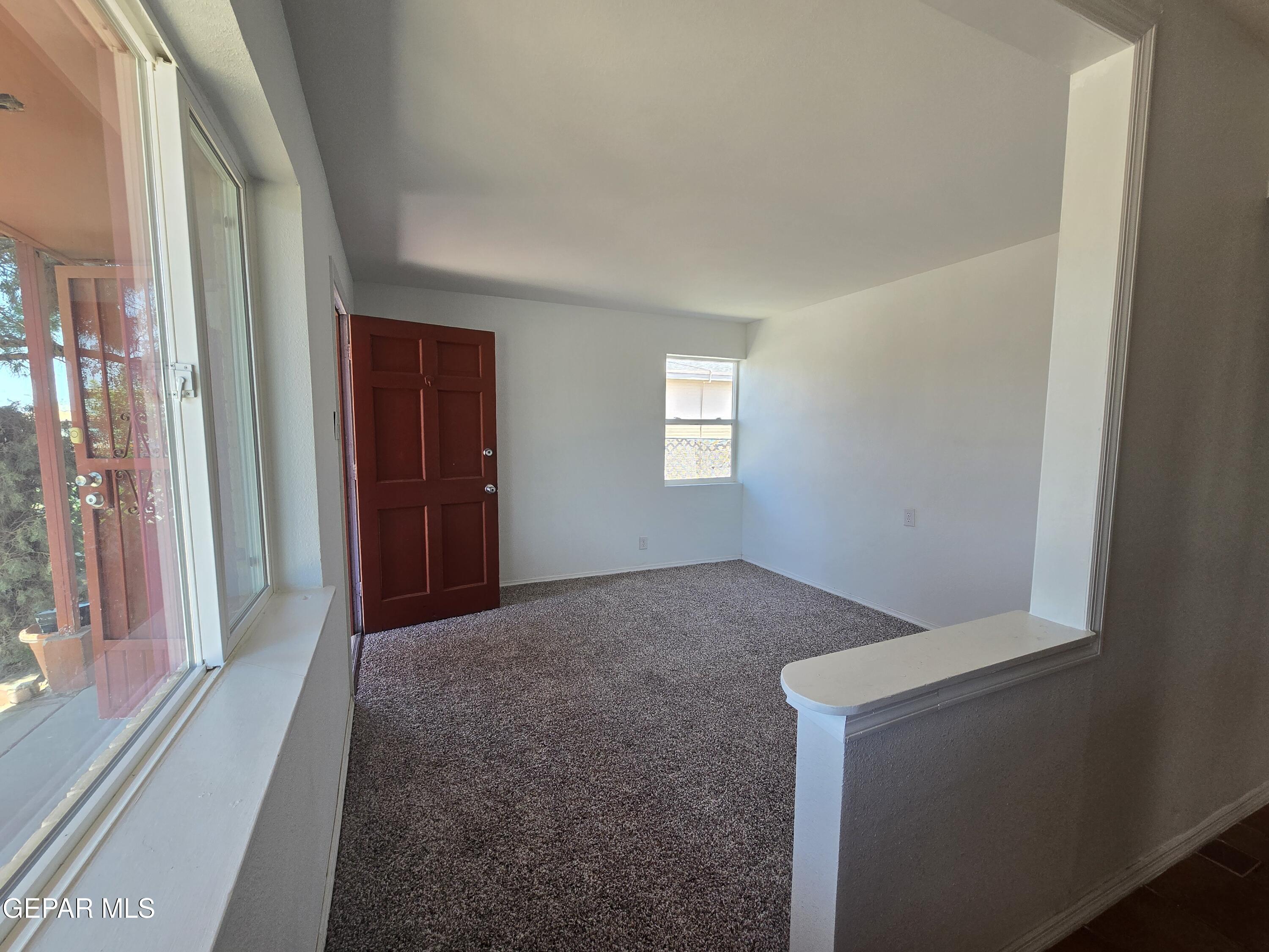226 Coronado Road El Paso, TX 79915 - Photo 5 of 22 a view of hallway with windows and chandelier