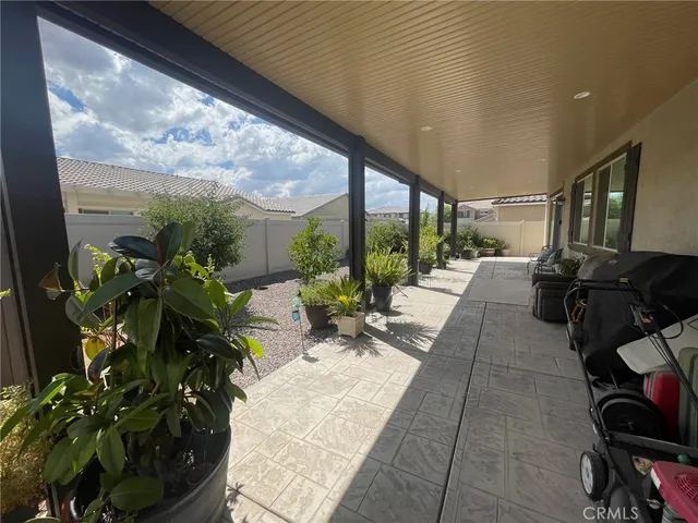 a lobby with furniture and floor to ceiling windows