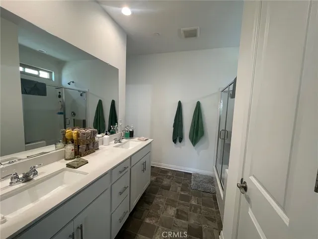 a bathroom with sink and mirror