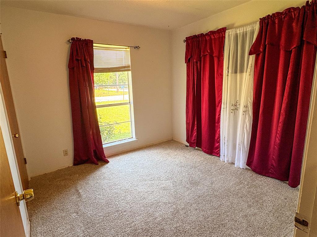 1829 South Center Street Denison, TX 75021 - Photo 18 of 29 a view of a room with windows and closet