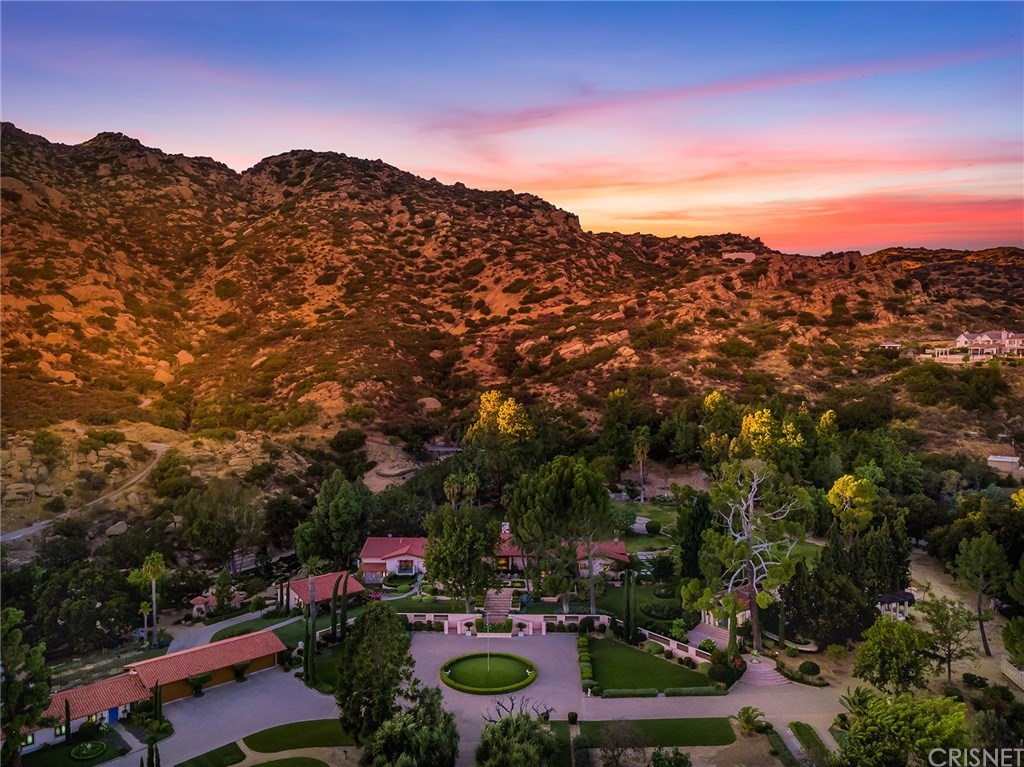 22637 La Quilla Drive Chatsworth, CA 91311 - Photo 1 of 36 a view of a city with mountains in the background