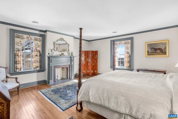 aerial view of a house with a garden and lake view