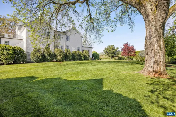 an aerial view of a house with a garden
