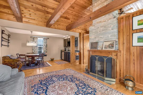 a view of a lake with a yard and a large window