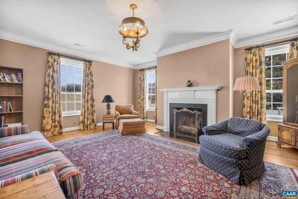 an aerial view of residential houses with outdoor space and swimming pool