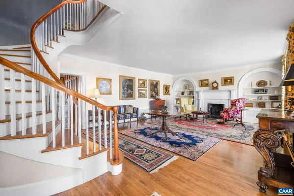 a living room filled with furniture and a rug
