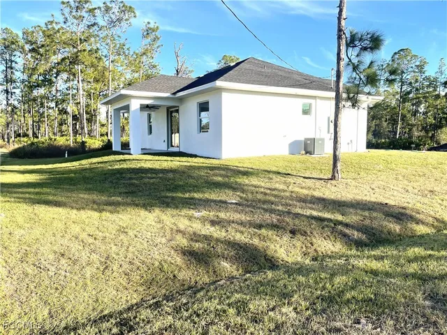 a view of a livingroom with furniture and a window