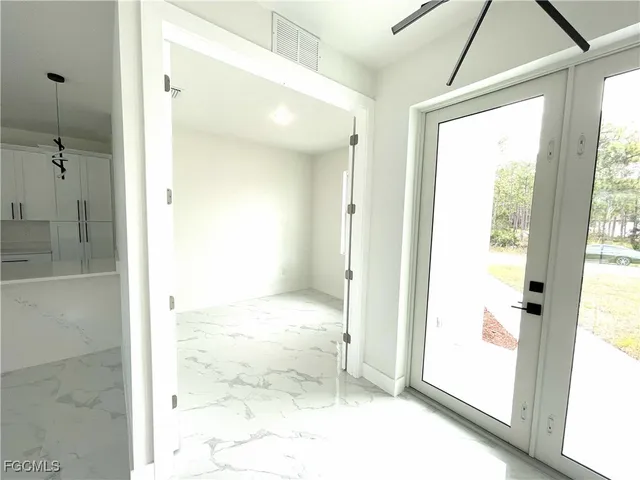 a view of a bathroom with a glass shower door