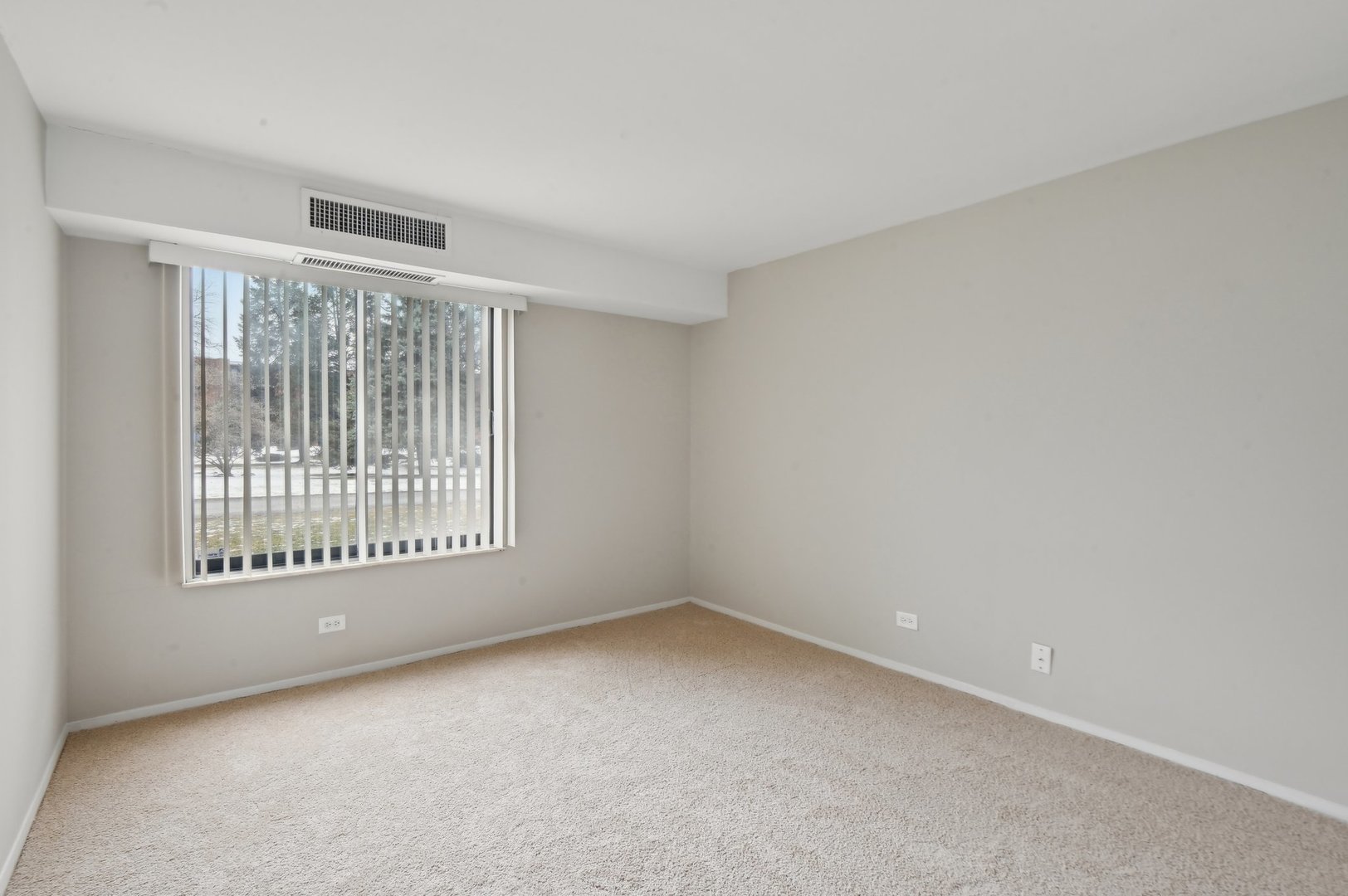 1615 East Central Road, Unit 121C Arlington Heights, IL 60005 - Photo 16 of 23 an empty room with a window
