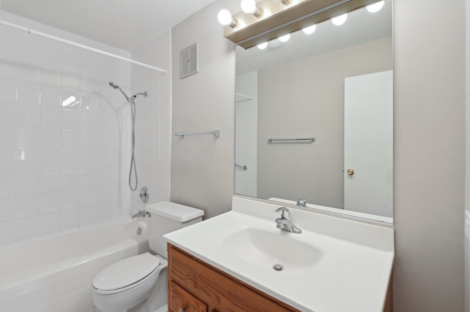 1615 East Central Road, Unit 121C Arlington Heights, IL 60005 - Photo 20 of 23 a bathroom with a sink toilet and shower