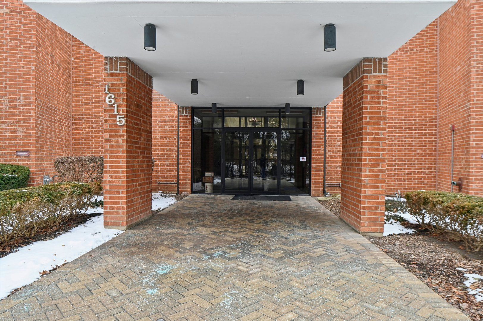 1615 East Central Road, Unit 121C Arlington Heights, IL 60005 - Photo 2 of 23 a view of entryway with a yard
