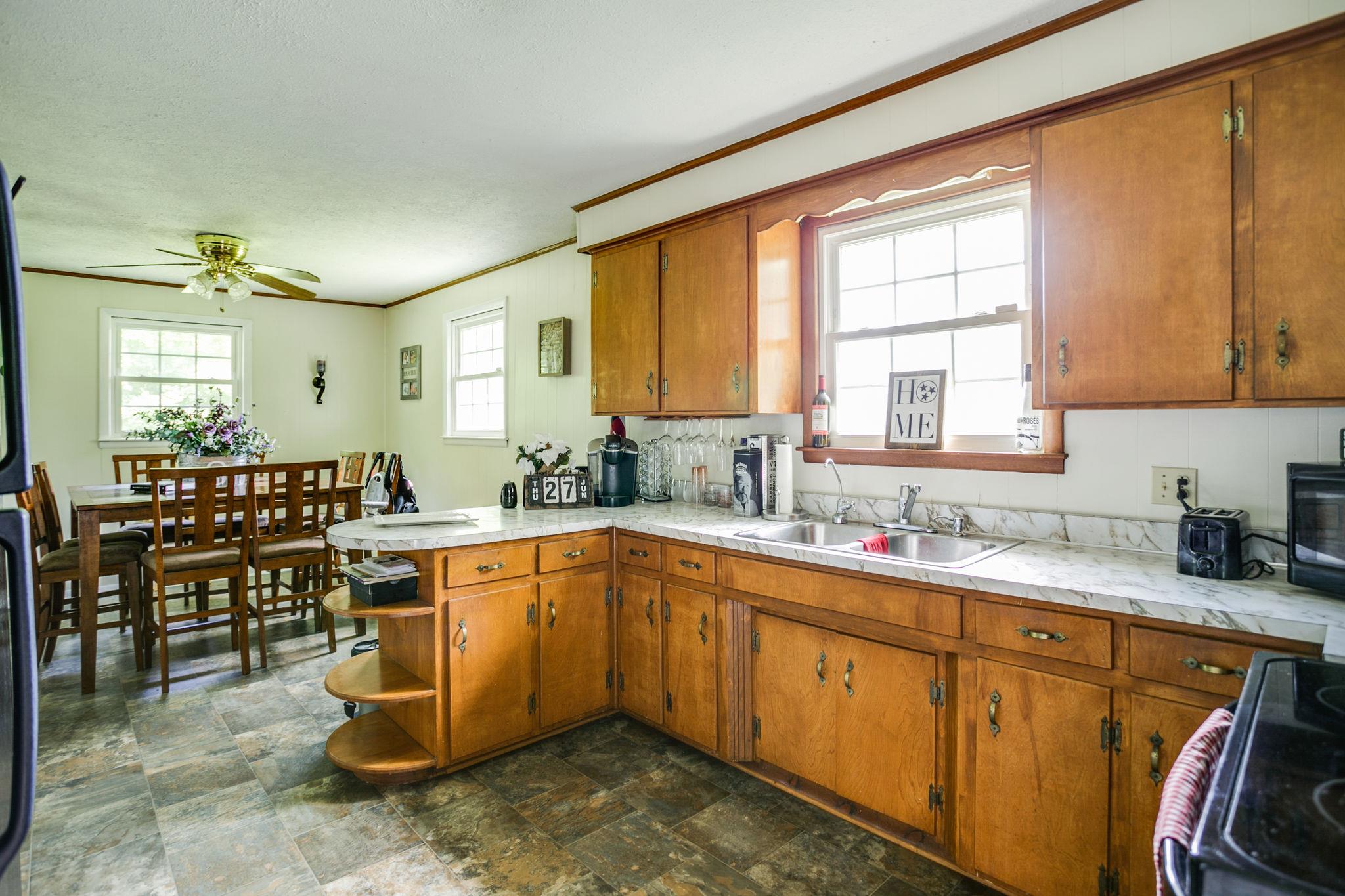 2818 Ewell Elliott Road Springfield, TN 37172 - Photo 11 of 24 a kitchen with sink a window and chairs