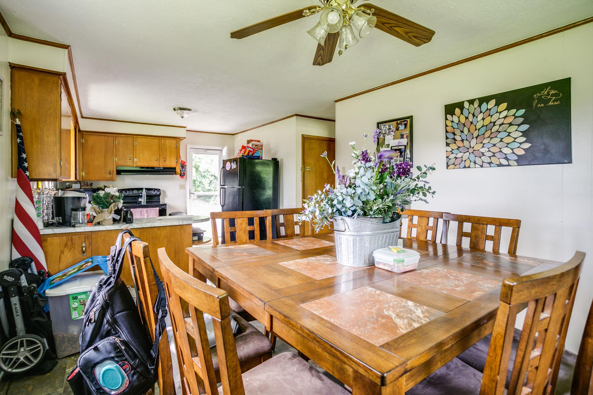 2818 Ewell Elliott Road Springfield, TN 37172 - Photo 13 of 24 a dining room with furniture a rug and wooden floor