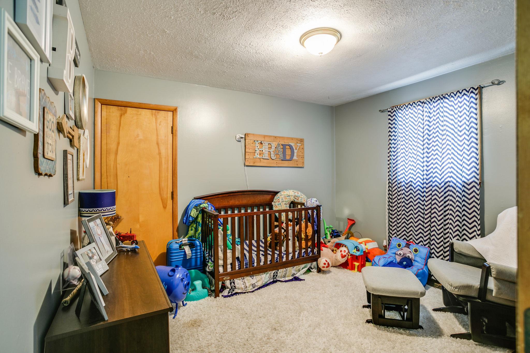 2818 Ewell Elliott Road Springfield, TN 37172 - Photo 16 of 24 a bedroom with furniture and a large window