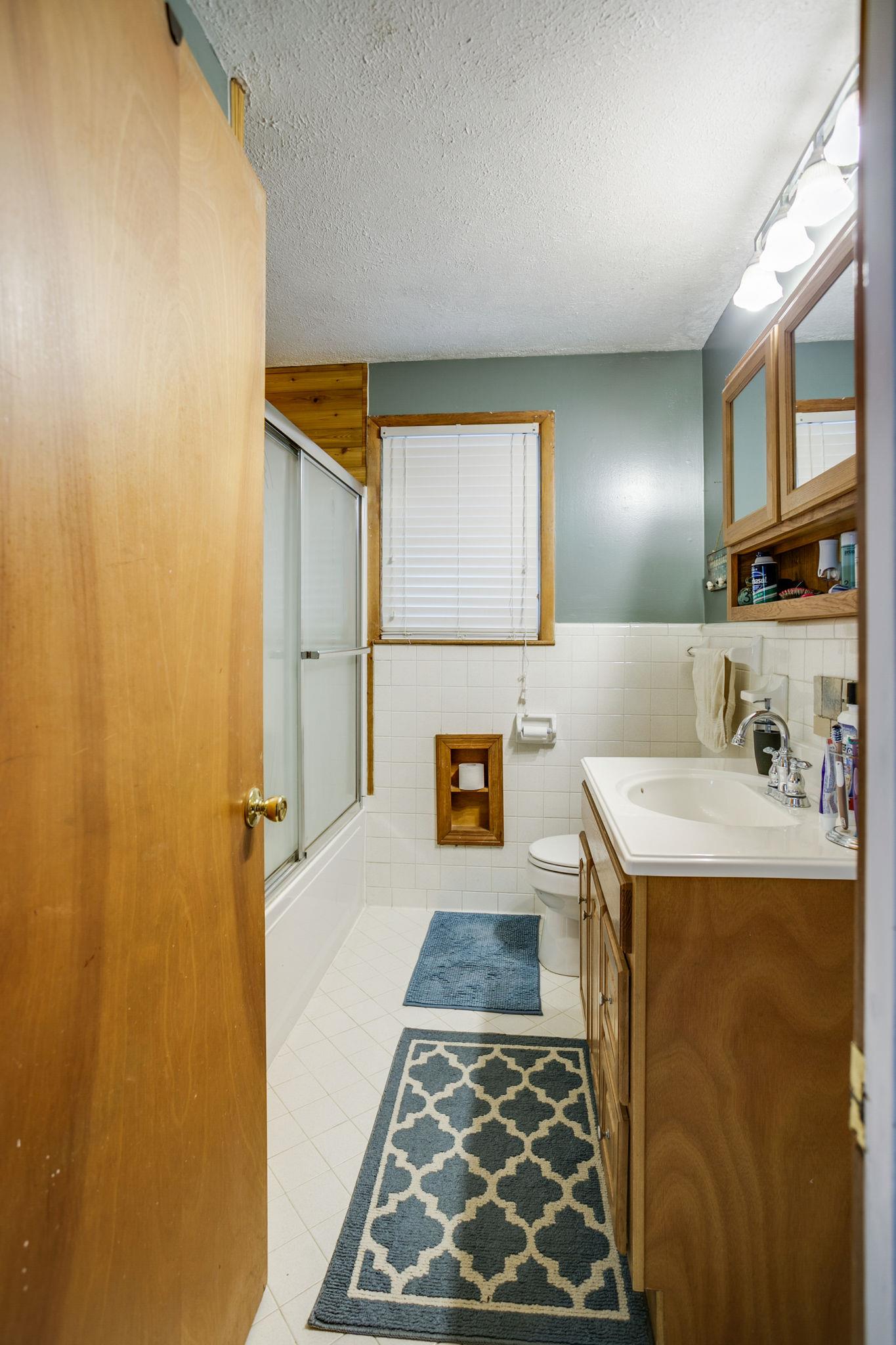 2818 Ewell Elliott Road Springfield, TN 37172 - Photo 17 of 24 a bathroom with a sink and a mirror