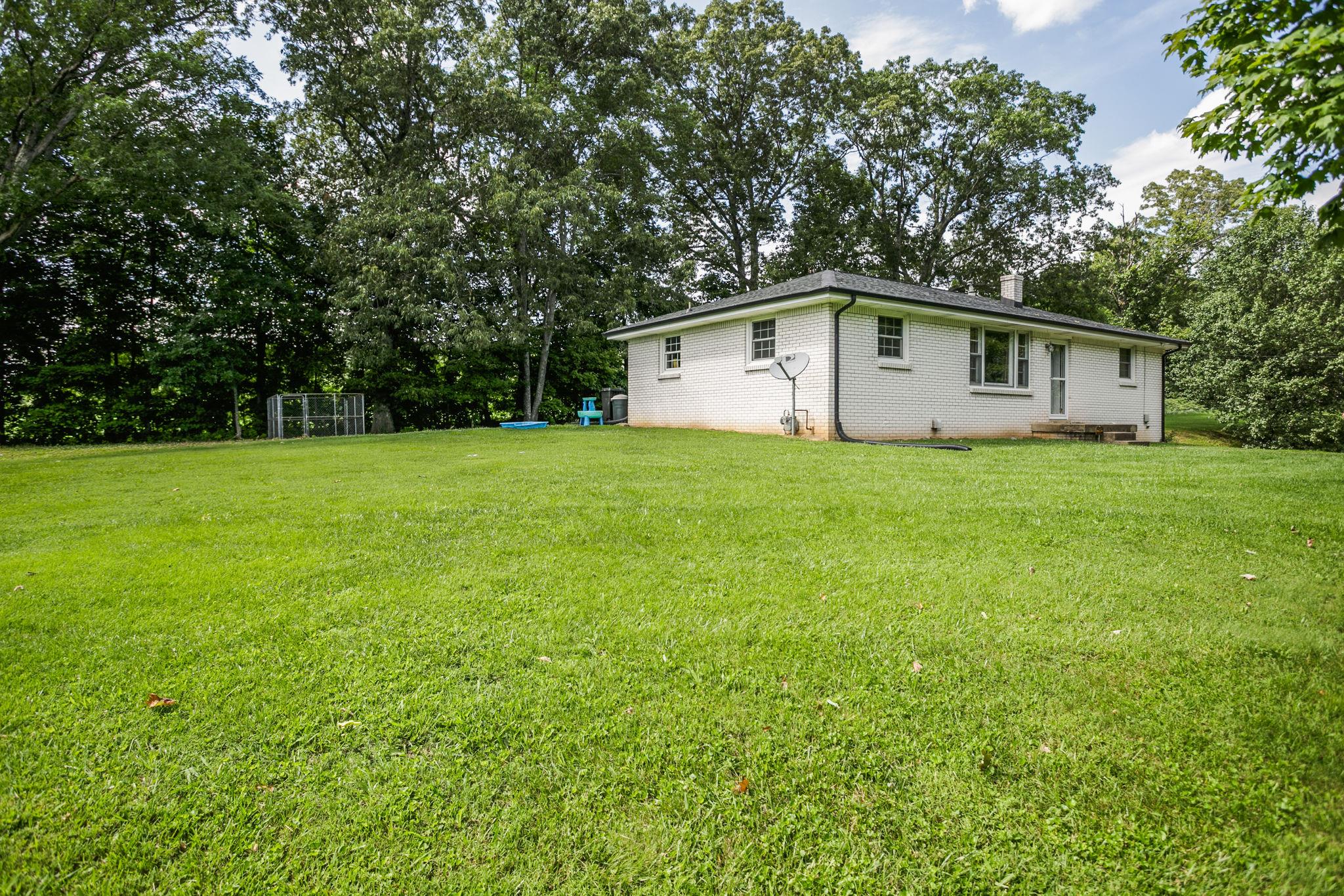 2818 Ewell Elliott Road Springfield, TN 37172 - Photo 3 of 24 a house with a tree in front of it