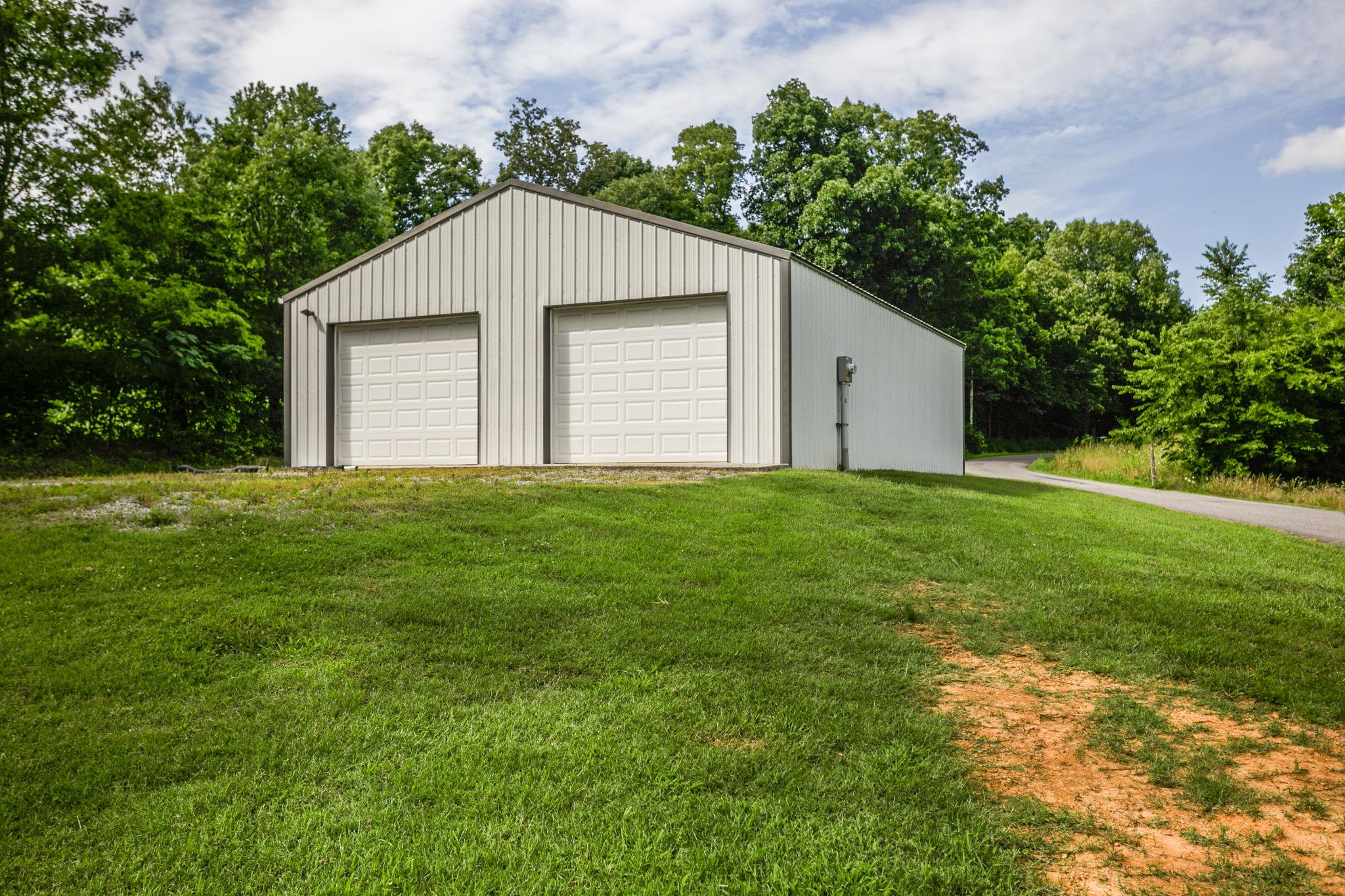 2818 Ewell Elliott Road Springfield, TN 37172 - Photo 23 of 24 a house that is sitting in the grass with tress in the background