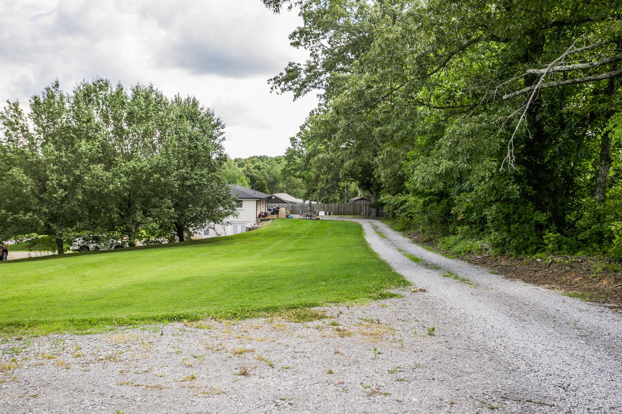 2818 Ewell Elliott Road Springfield, TN 37172 - Photo 7 of 24 a view of a field with a trees in the background