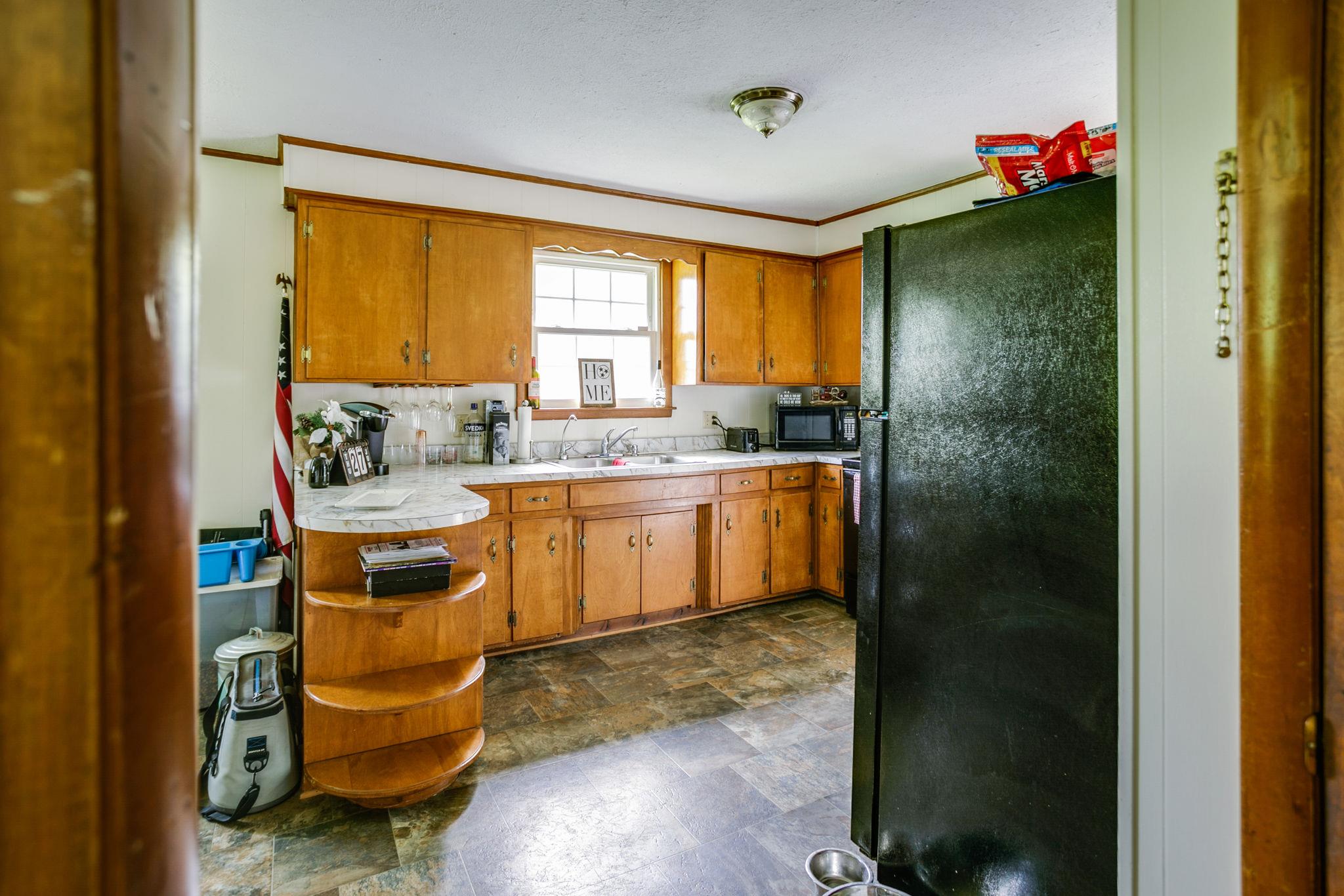 2818 Ewell Elliott Road Springfield, TN 37172 - Photo 9 of 24 a kitchen that has a sink and a stove in it